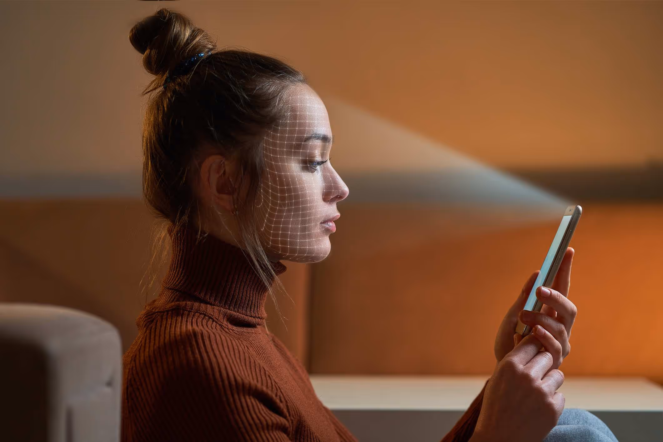A phone scans a woman’s face without her consent.