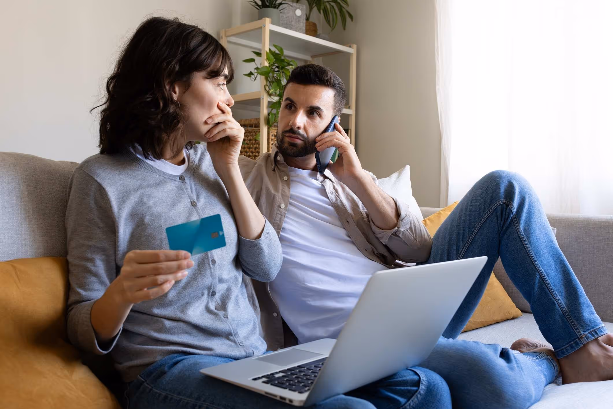 A couple contacting an identity theft lawyer after discovering fraudulent charges.
