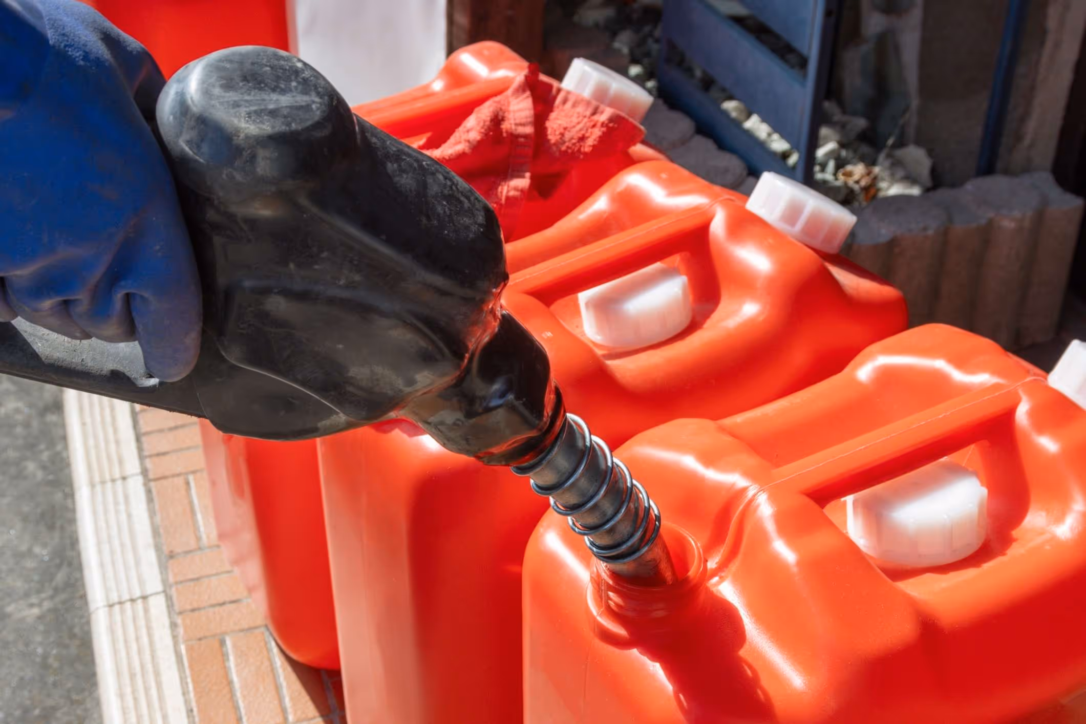 Red plastic portable gasoline containers