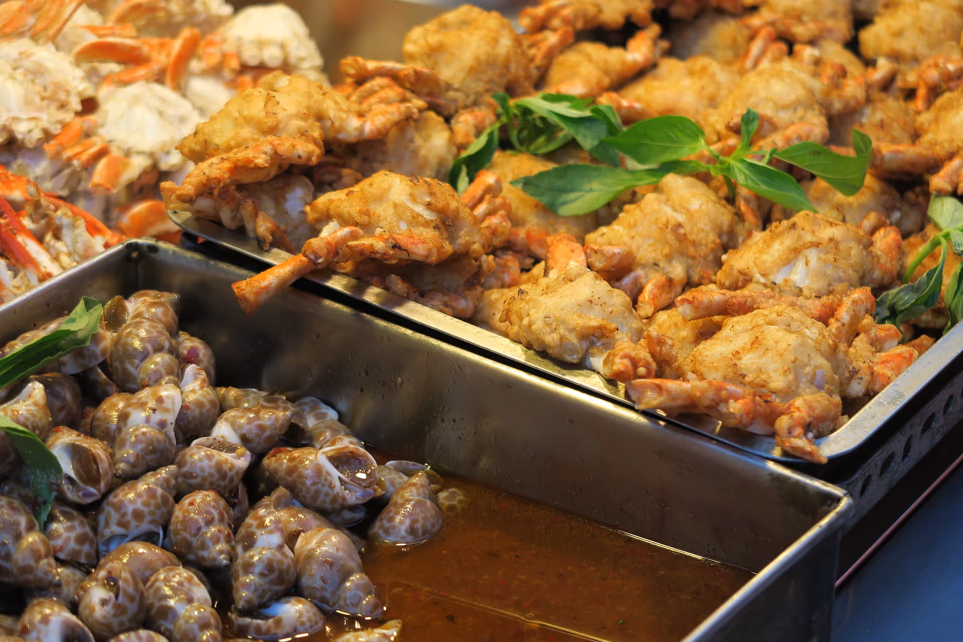 Food in trays at a buffet