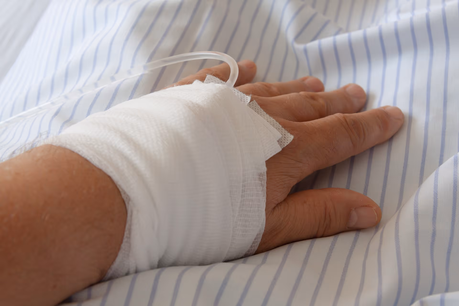 bandage on the hand of a hospitalized patient