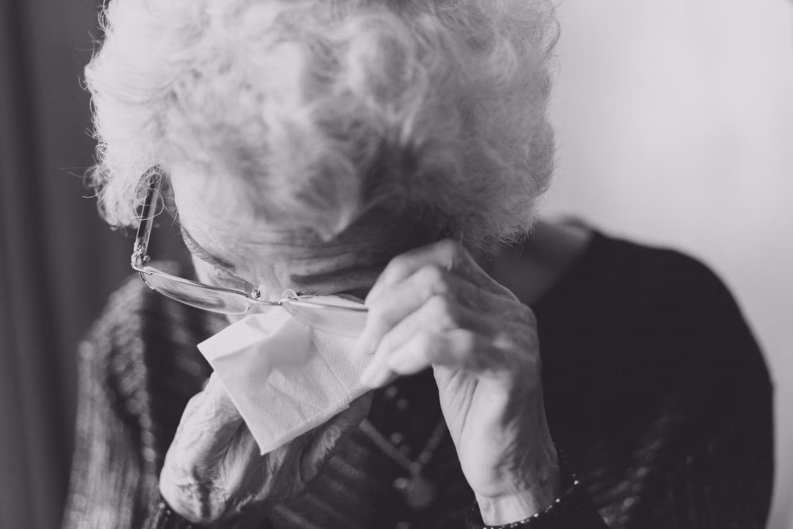 an older woman weeping