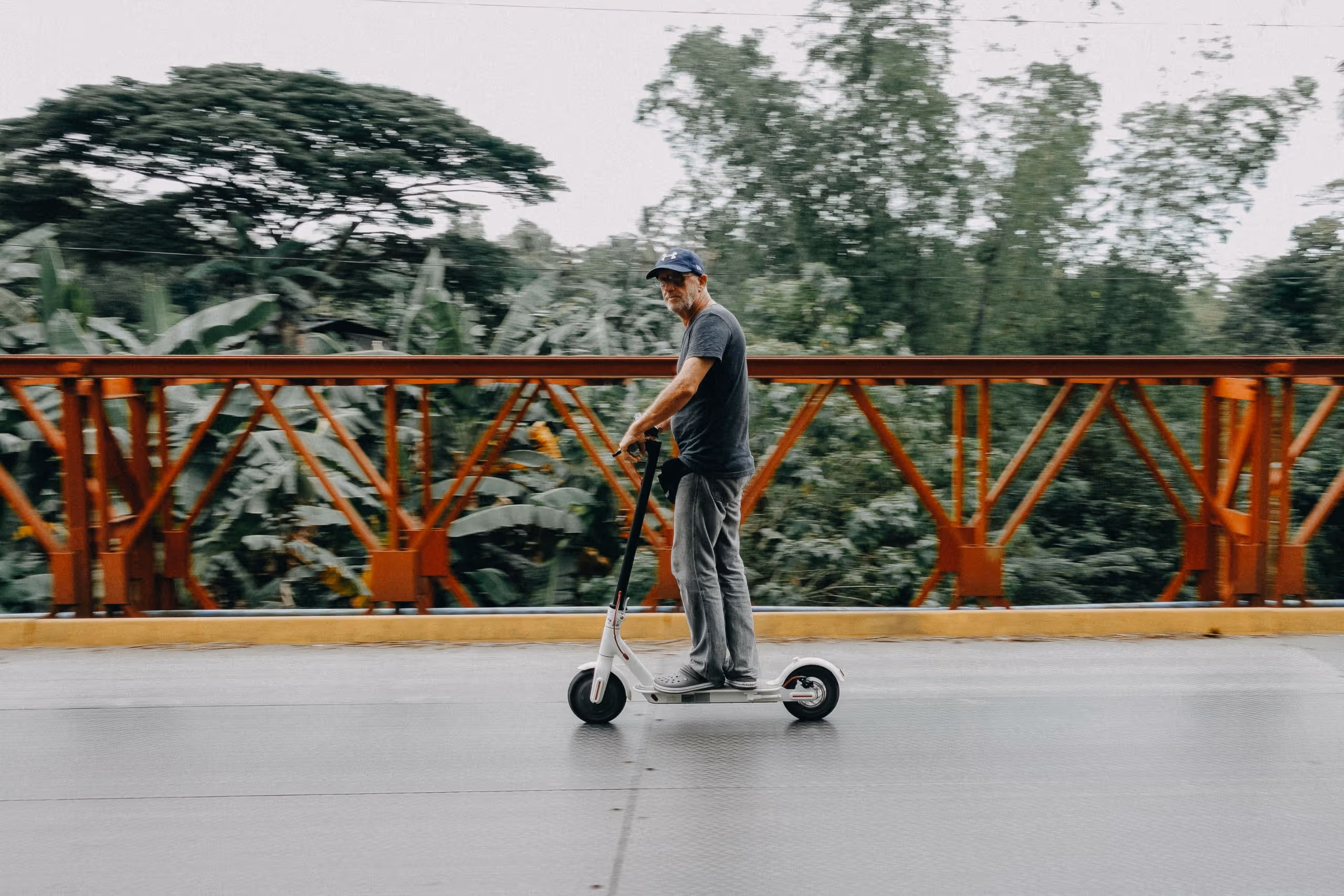 A man riding an e scooter