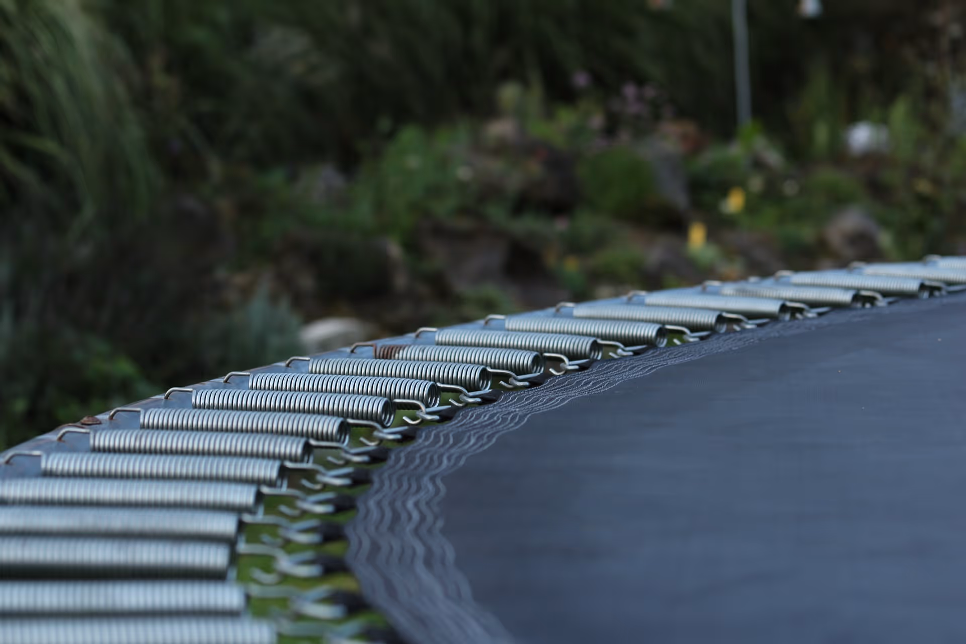A trampoline in the backyard of a home