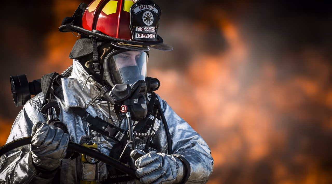 a firefighter fighting a blaze