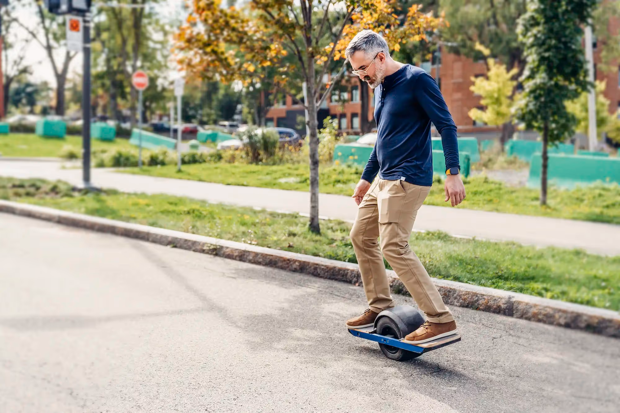 Man rides a Onewheel skateboard device