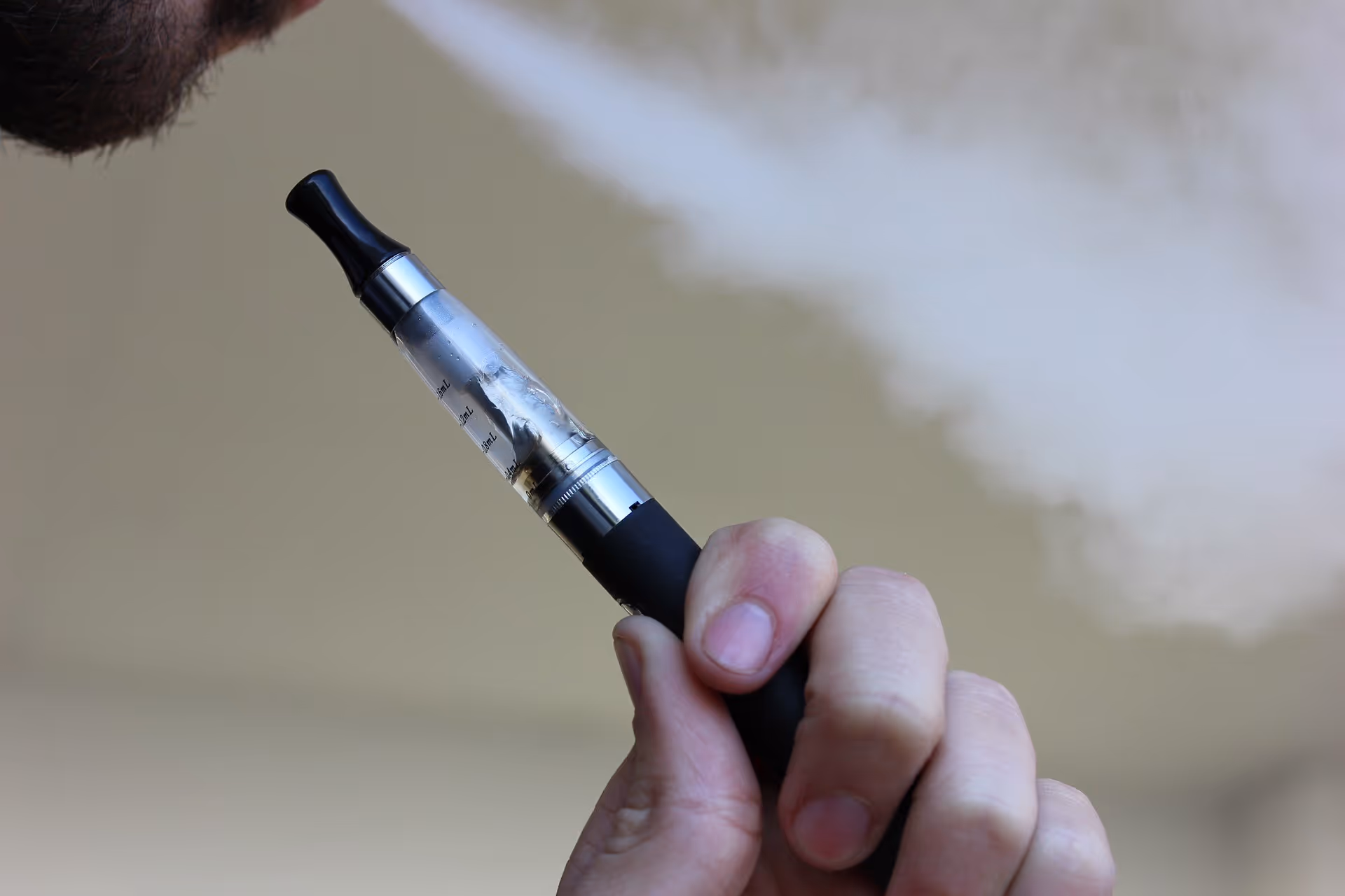 man holding vape pen