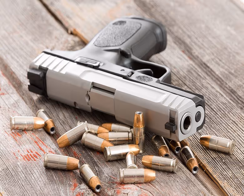 handgun and live rounds