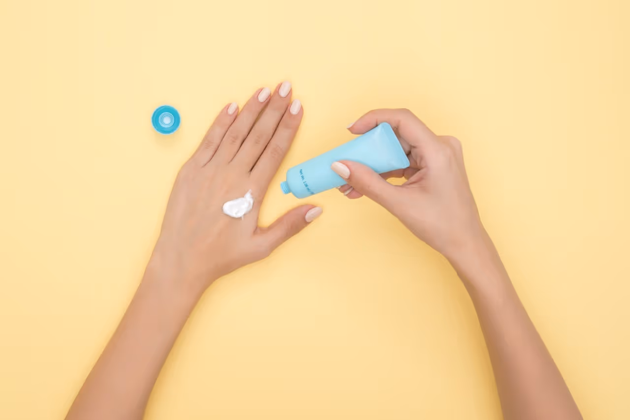 woman applying sunscreen