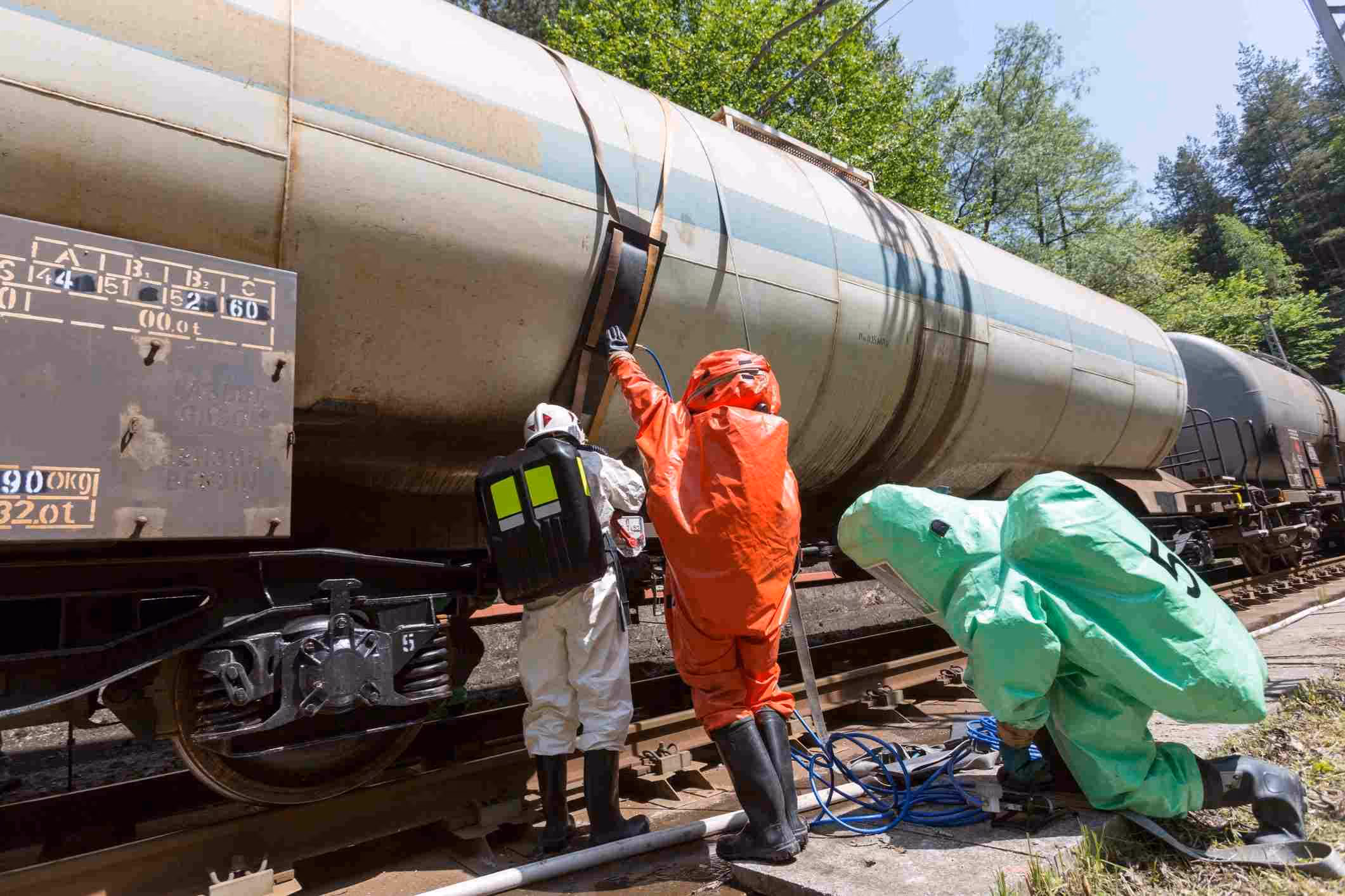 A team assessing a train after a toxic chemical spill train.