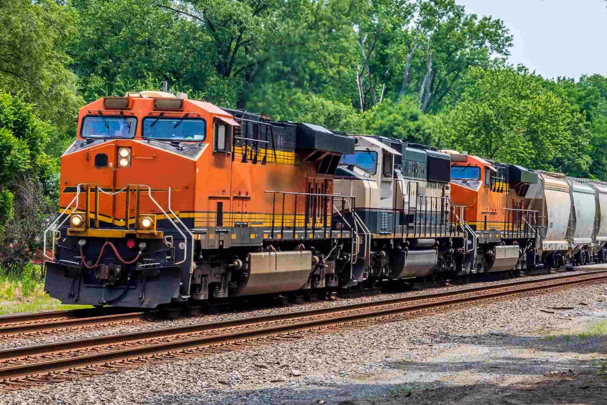 Freight train on railroad tracks, representing a California railroad workers cancer lawsuit involving diesel fumes, asbestos, and other toxic substances.