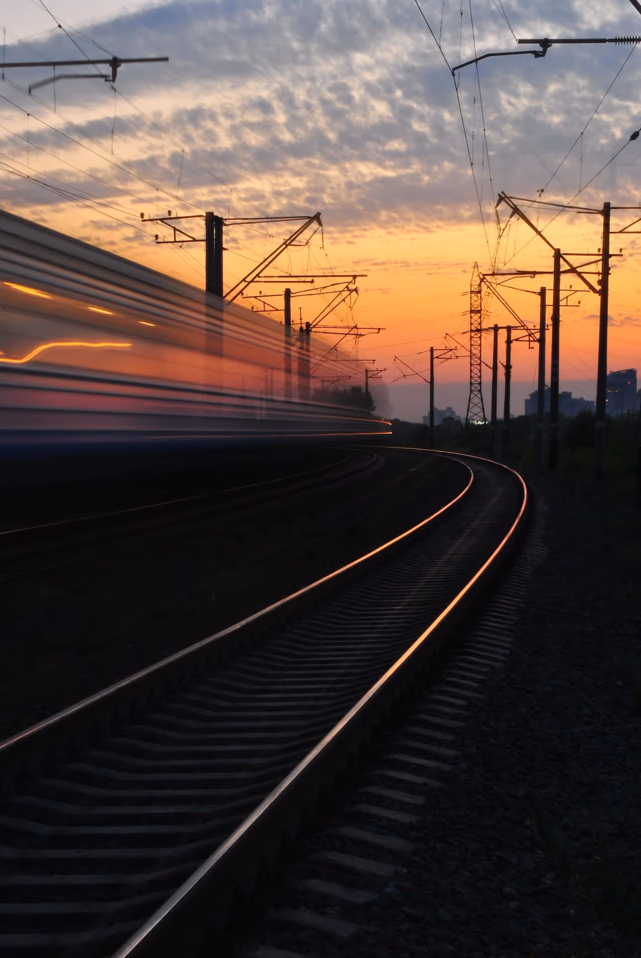 A train blurred in motion on railroad tracks