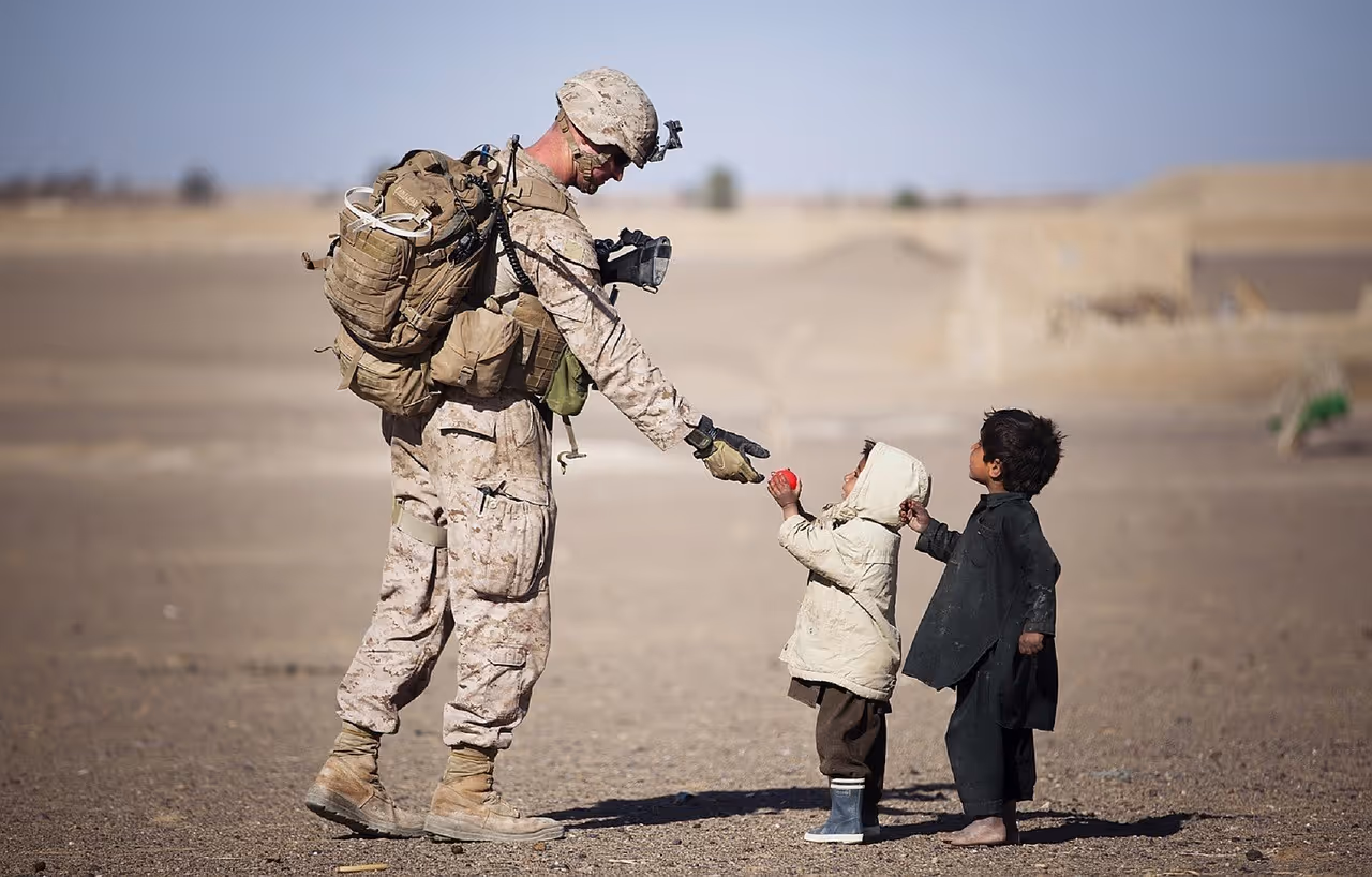 gulf war soldier playing with local children