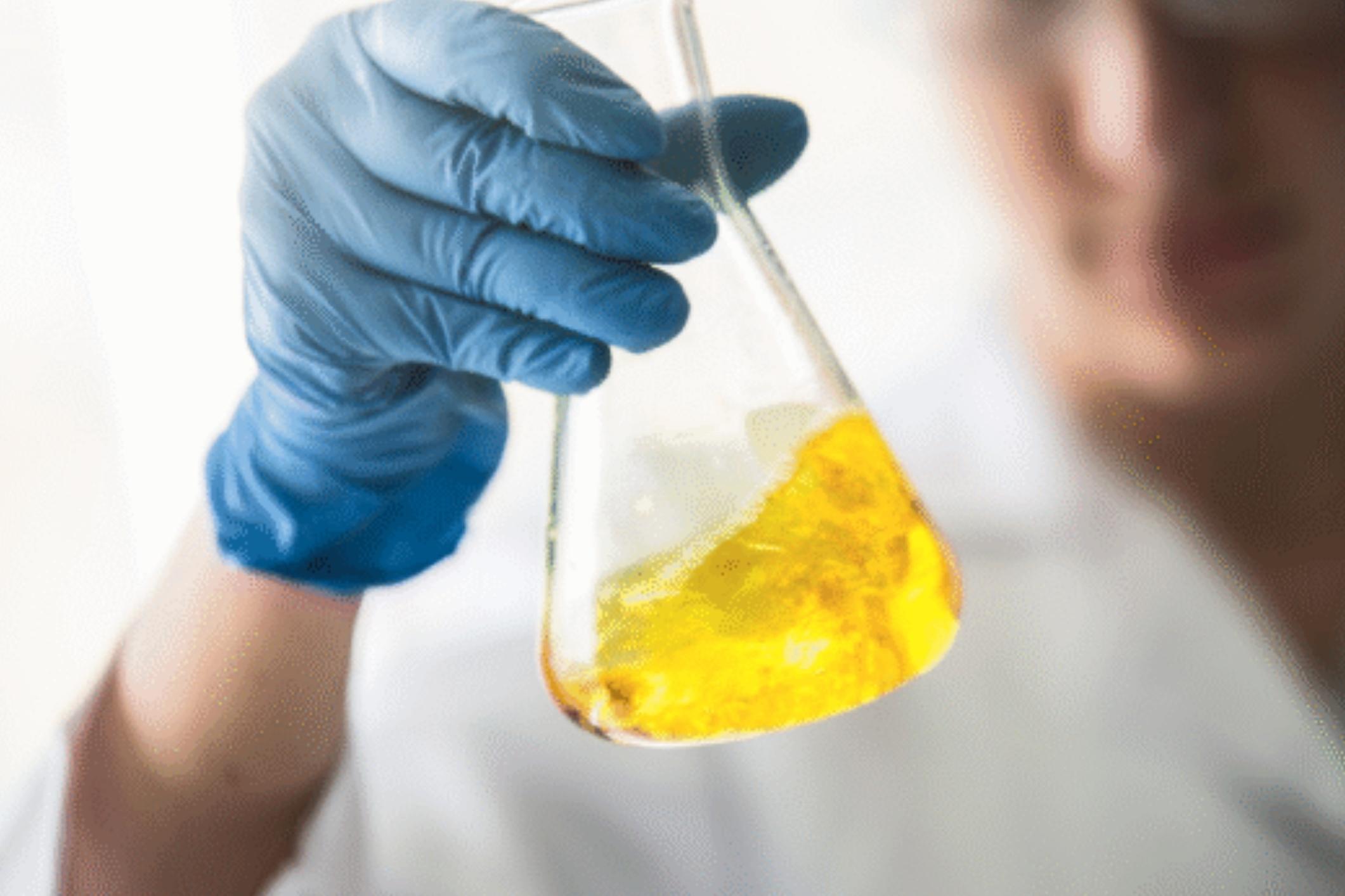 Worker handling toxic chemical, showing how a toxic exposure lawyer protects victims.