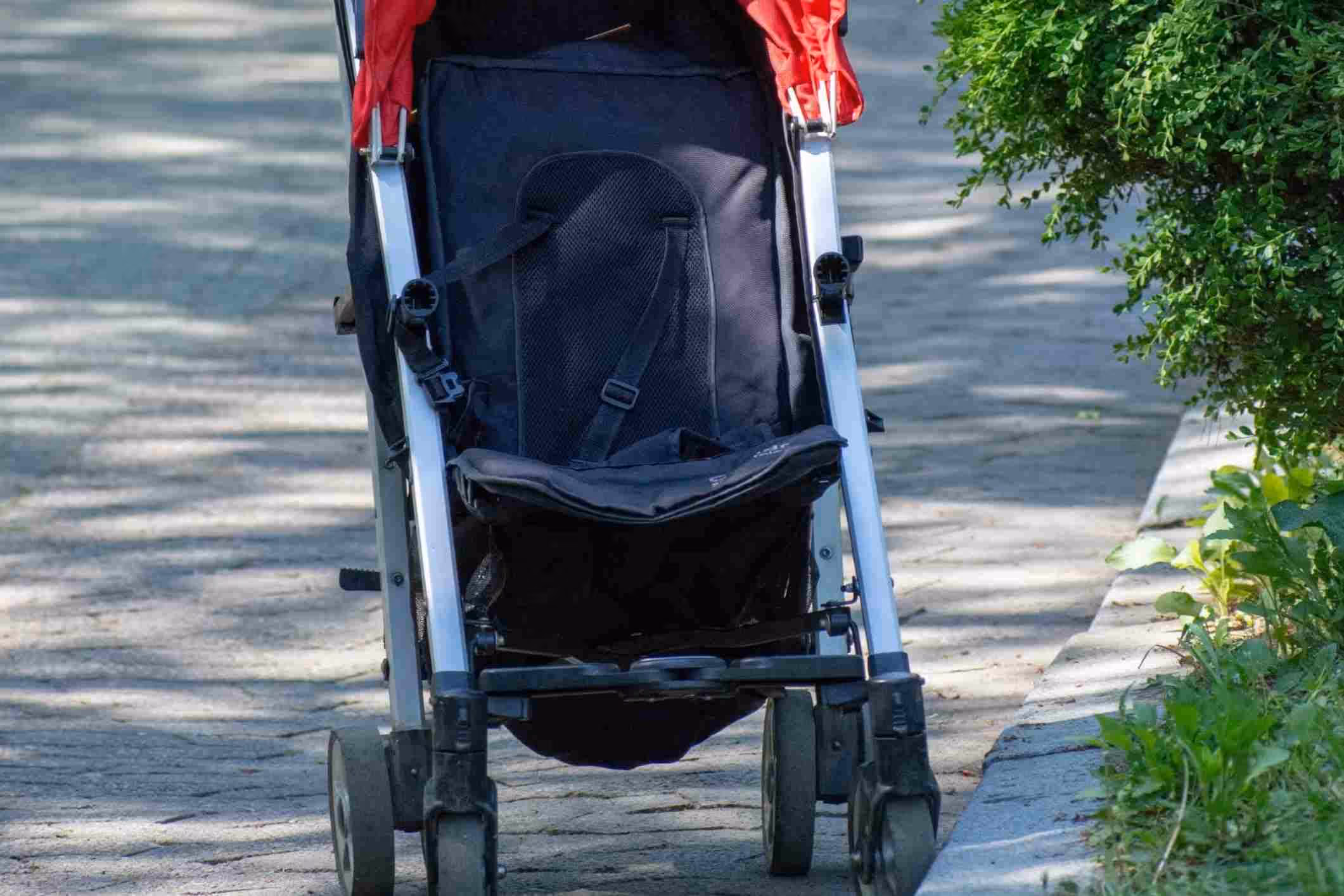 empty stroller sitting idle in the park