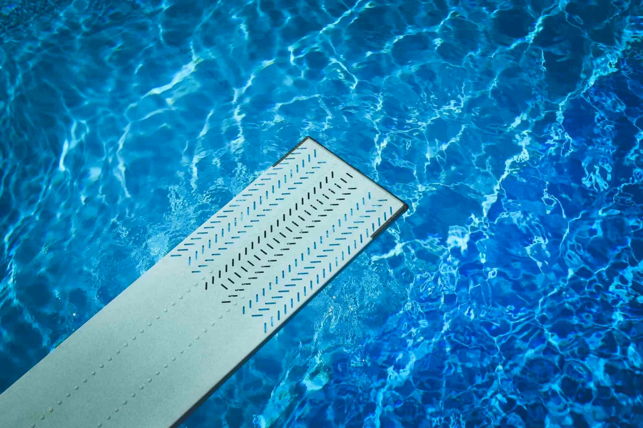 A diving board and swimming pool