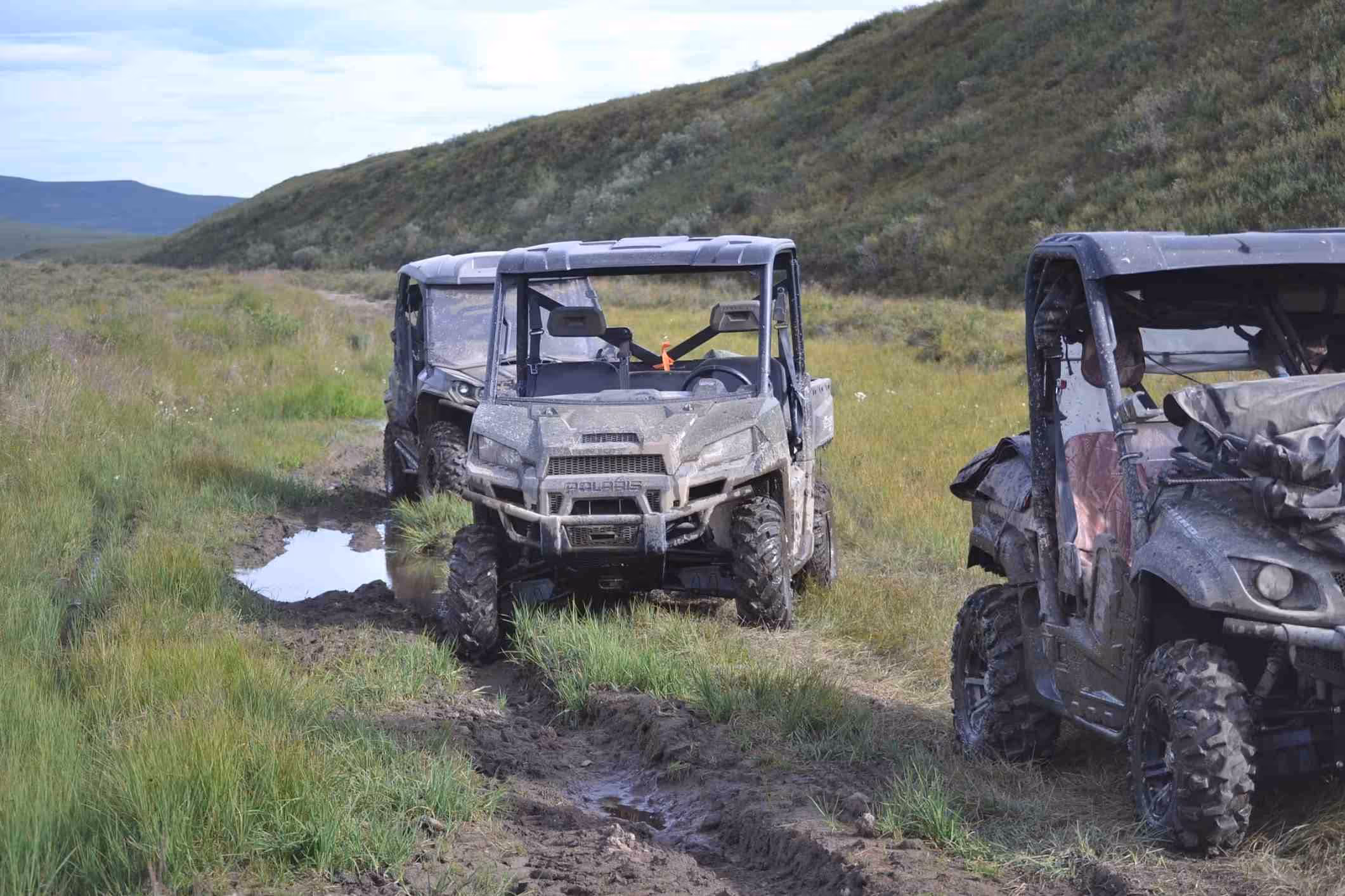 polaris atv on muddy trail