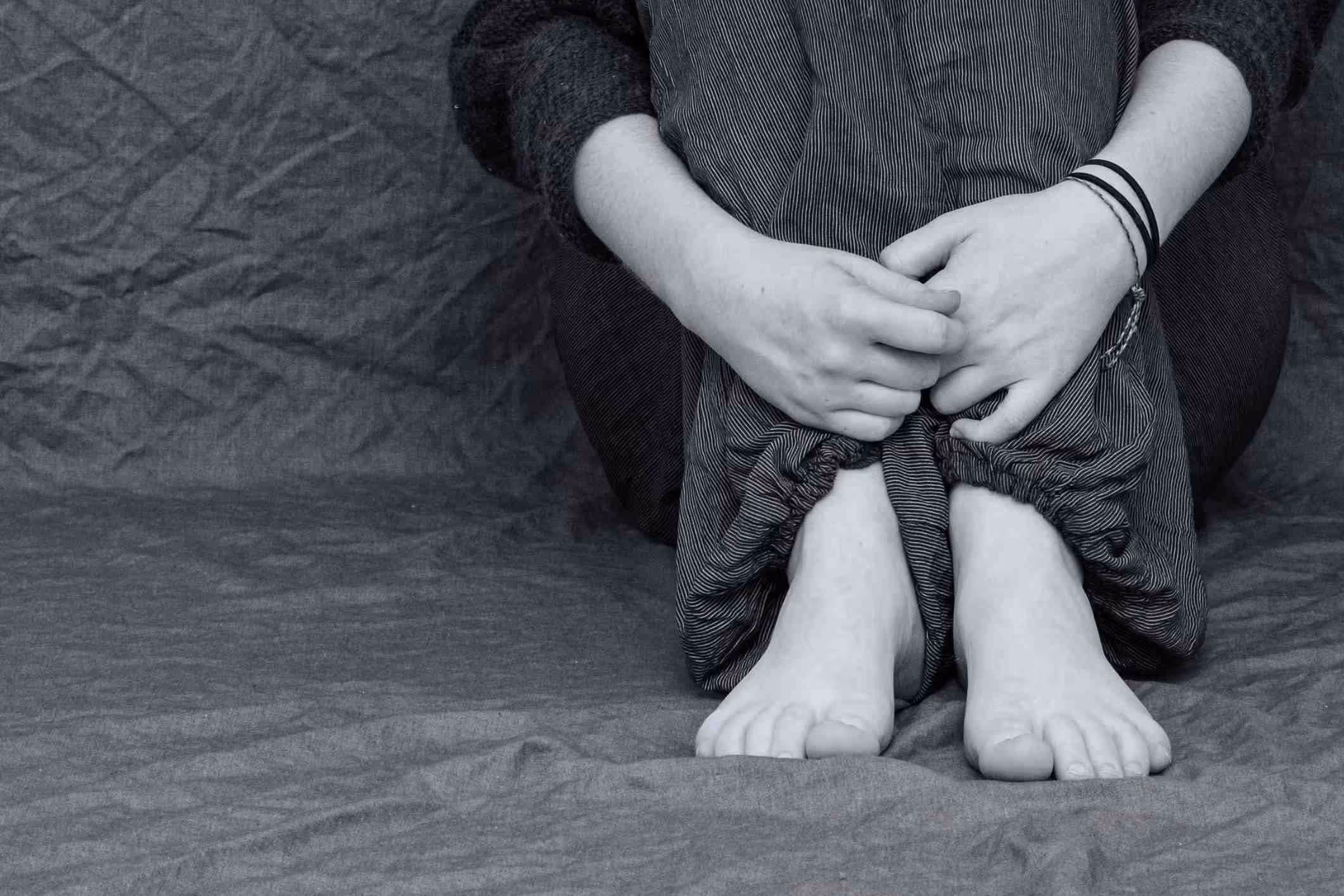 sexual abuse victim sitting alone