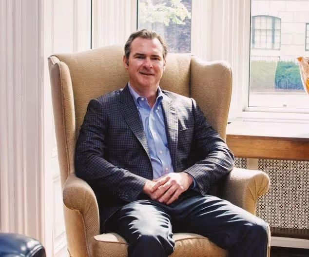 Joe lyon sitting in a chair