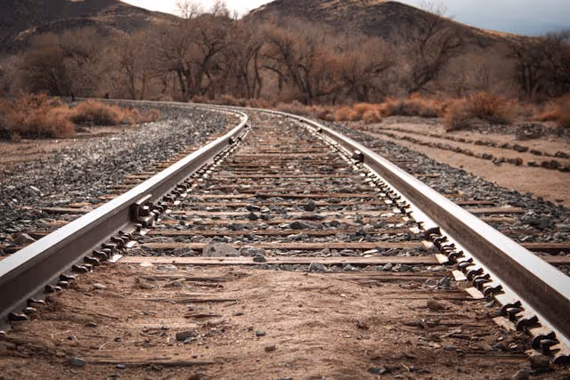 Curved railroad track view in a western state