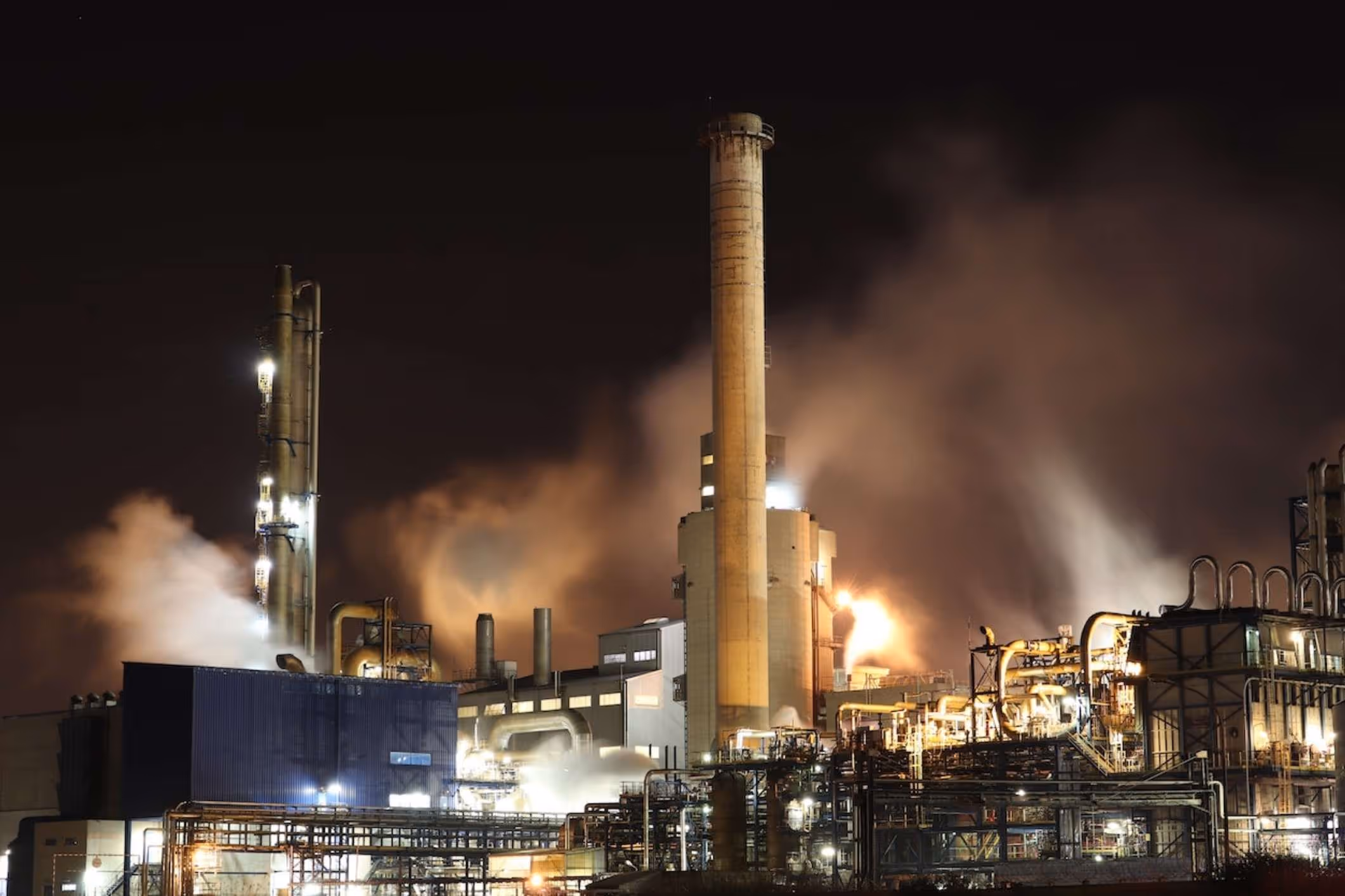 chemical plant seen at a distance at night