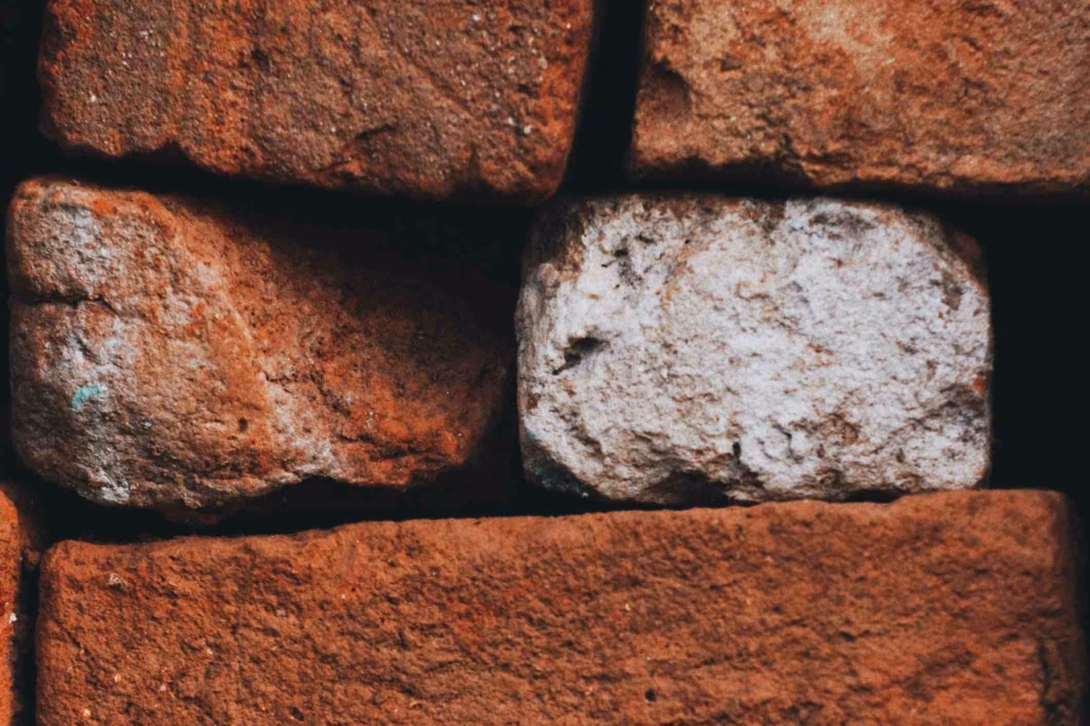 Poorly stacked bricks, looking unstable