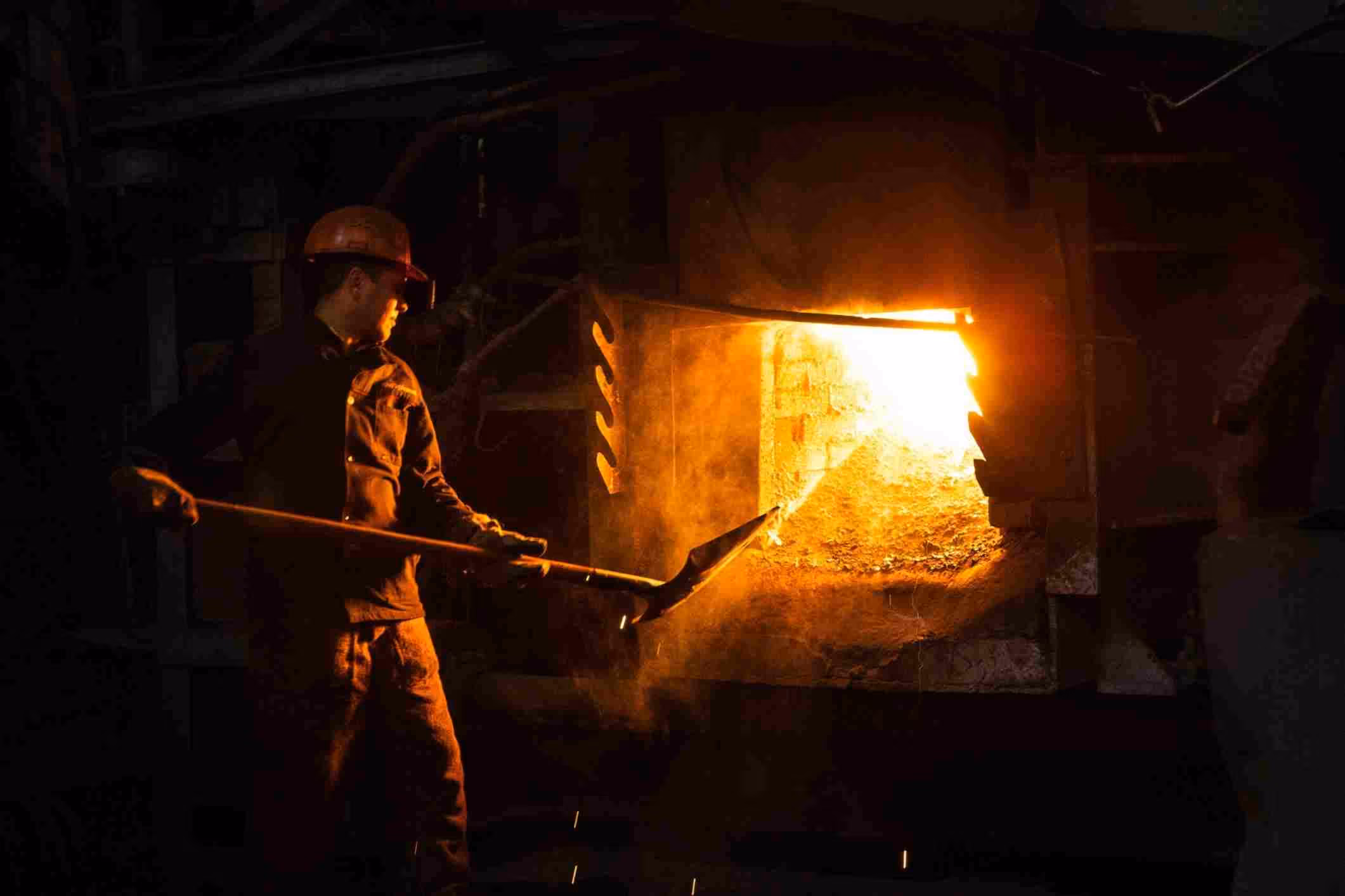 photo of steel worker in steel plant