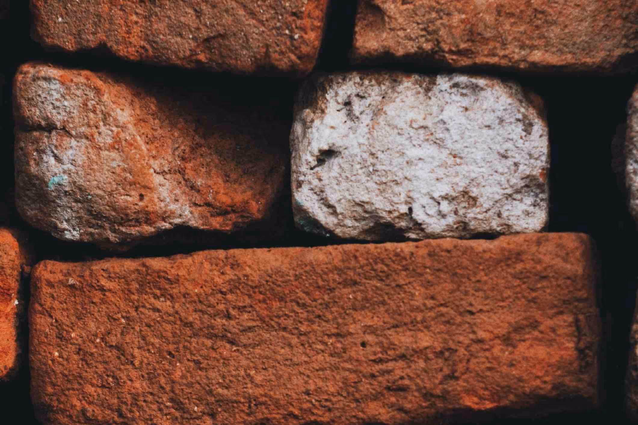 Poorly stacked bricks, looking unstable