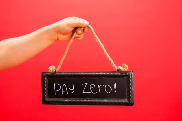 A sign advertising "pay zero," a common tactic in false advertising campaigns