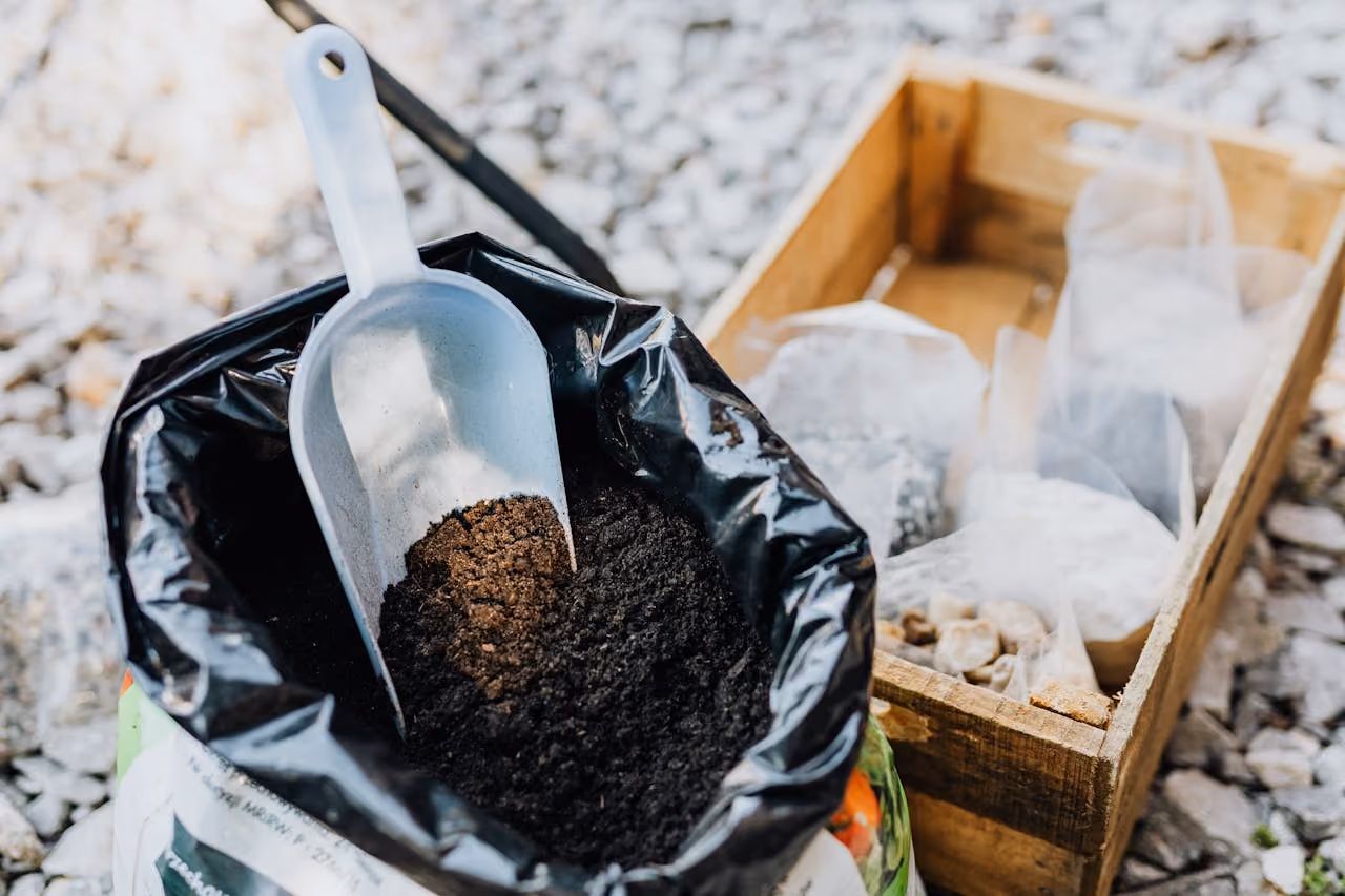 A trash bag full of compost and soil