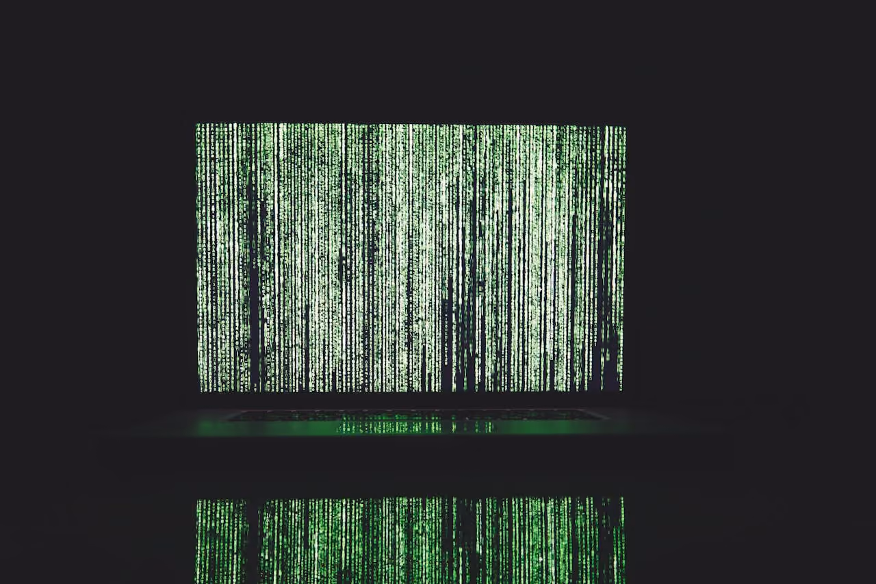 Binary code on a computer in green font