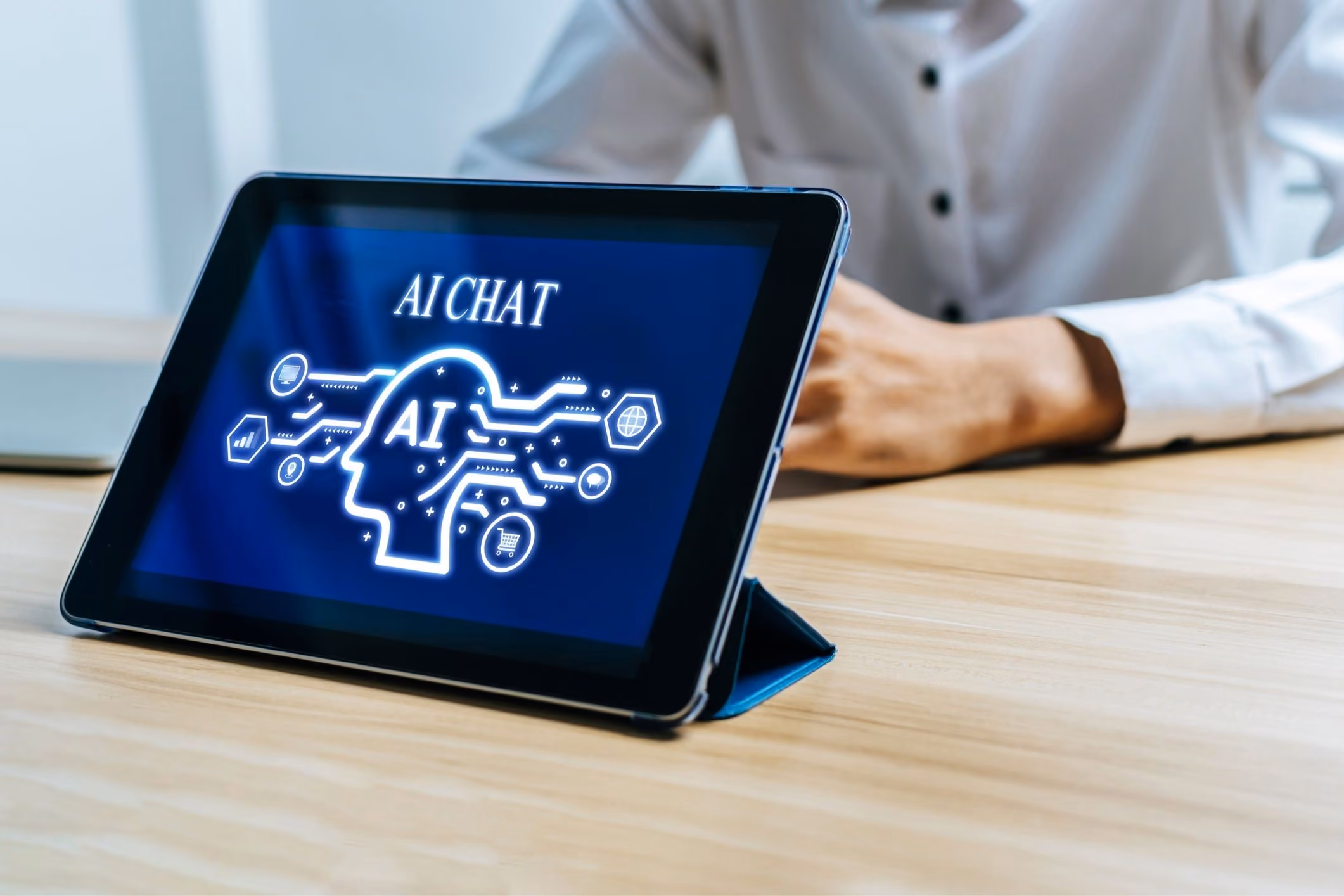 Man using an AI chatbot on a tablet, representing AI product liability lawsuit claims.