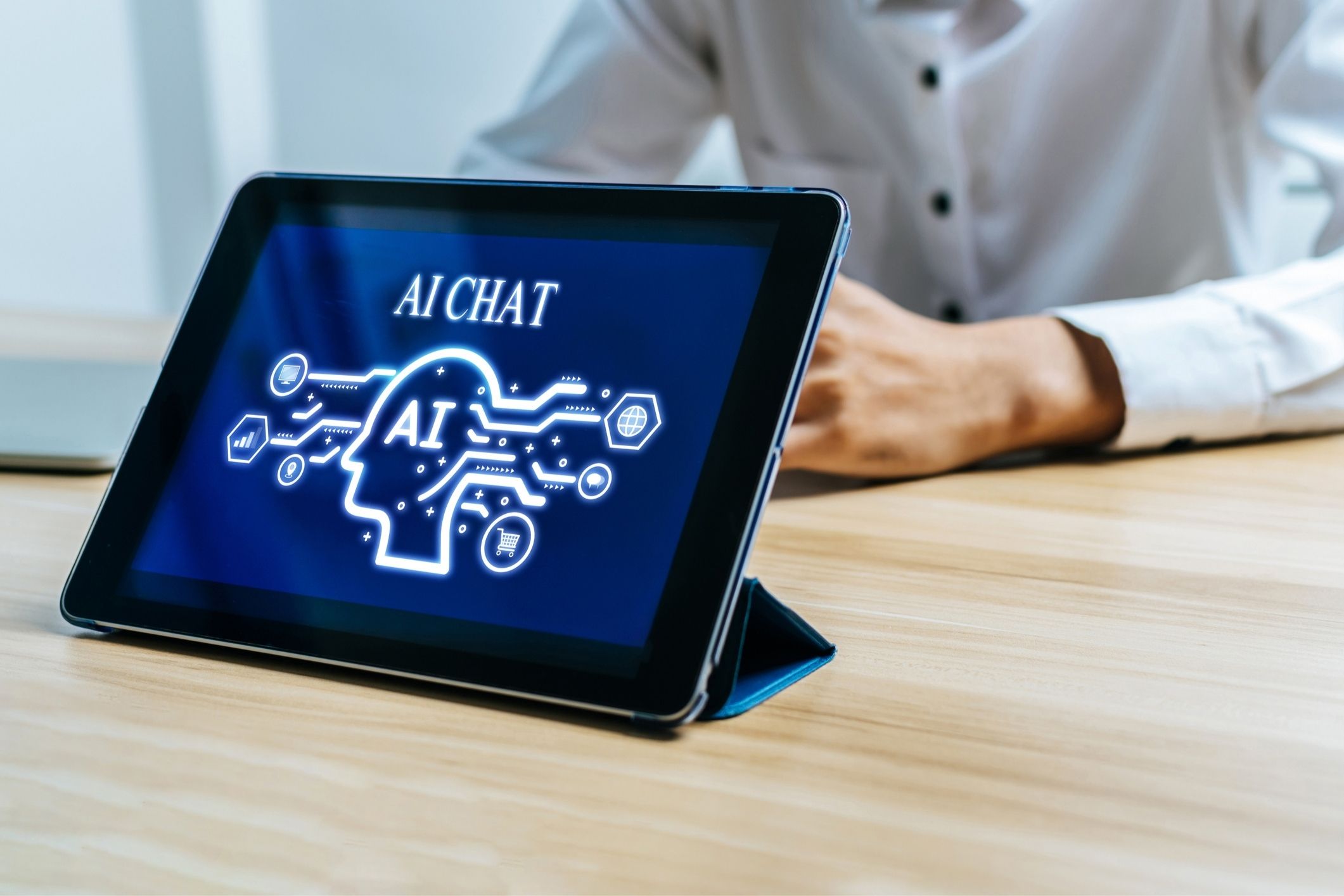 Man using an AI chatbot on a tablet, representing AI product liability lawsuit claims.