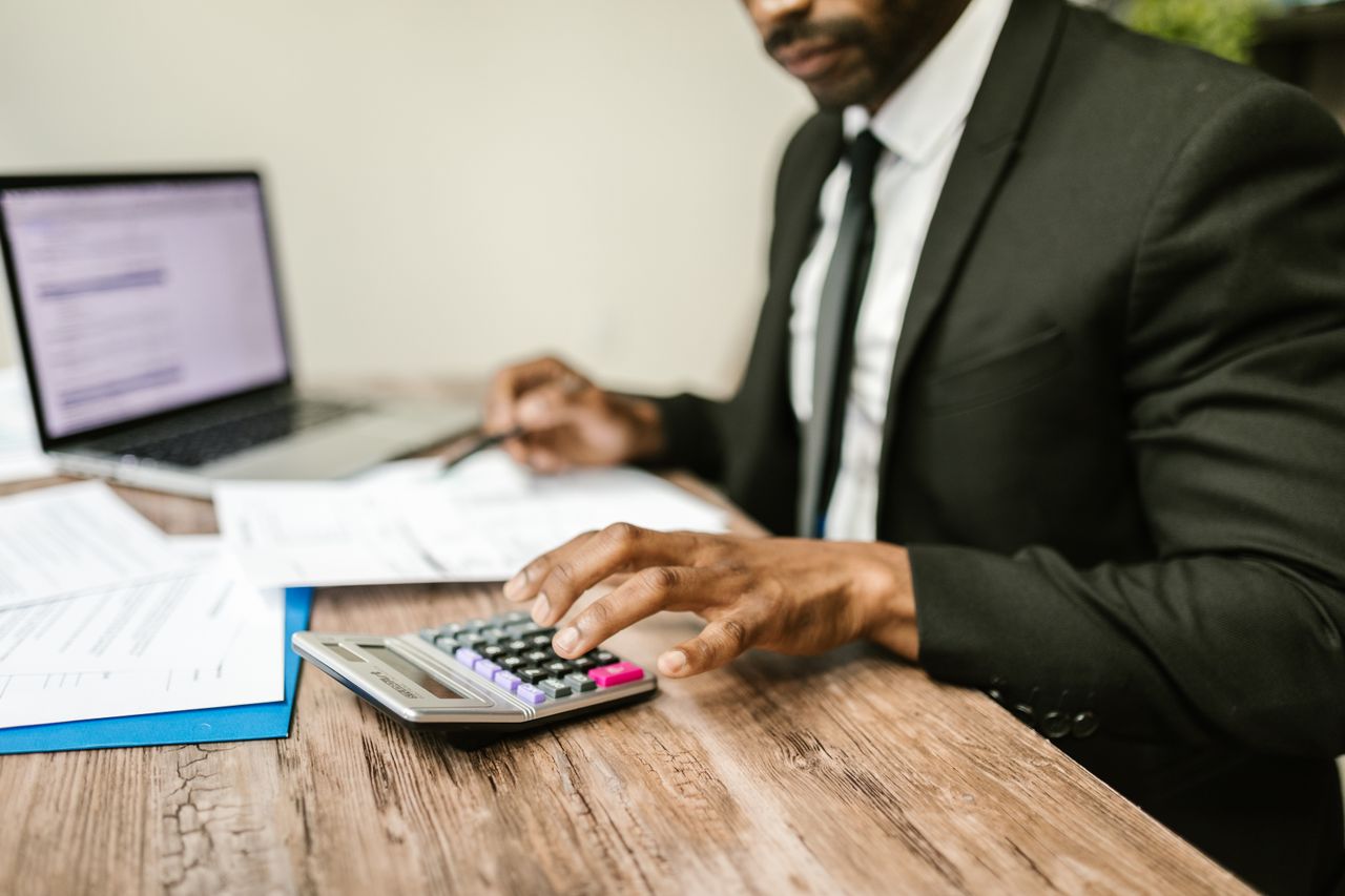 an accountant seen calculating figures