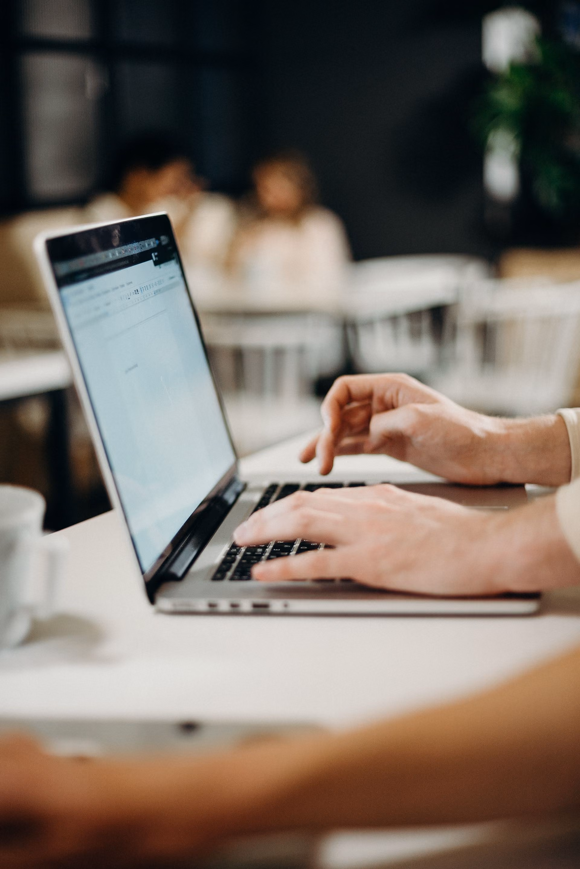 person checking emails on their laptop