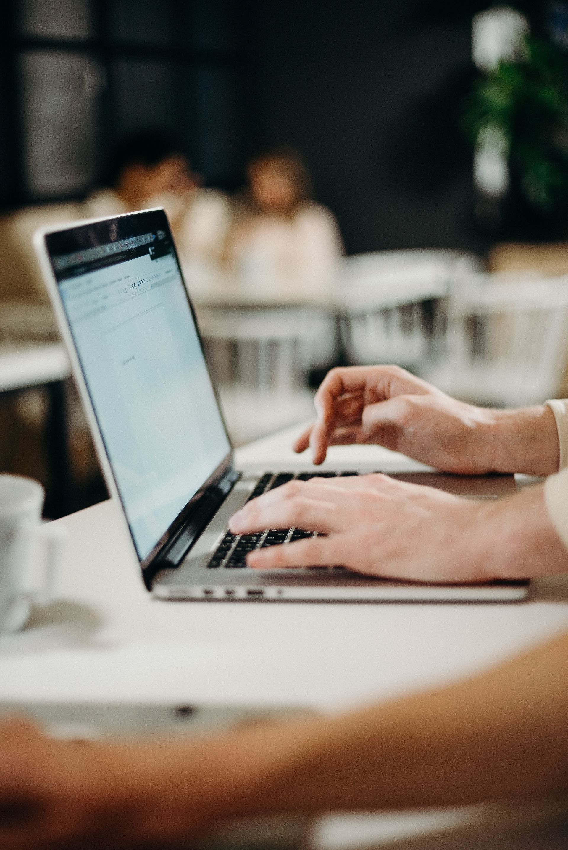 person checking emails on their laptop