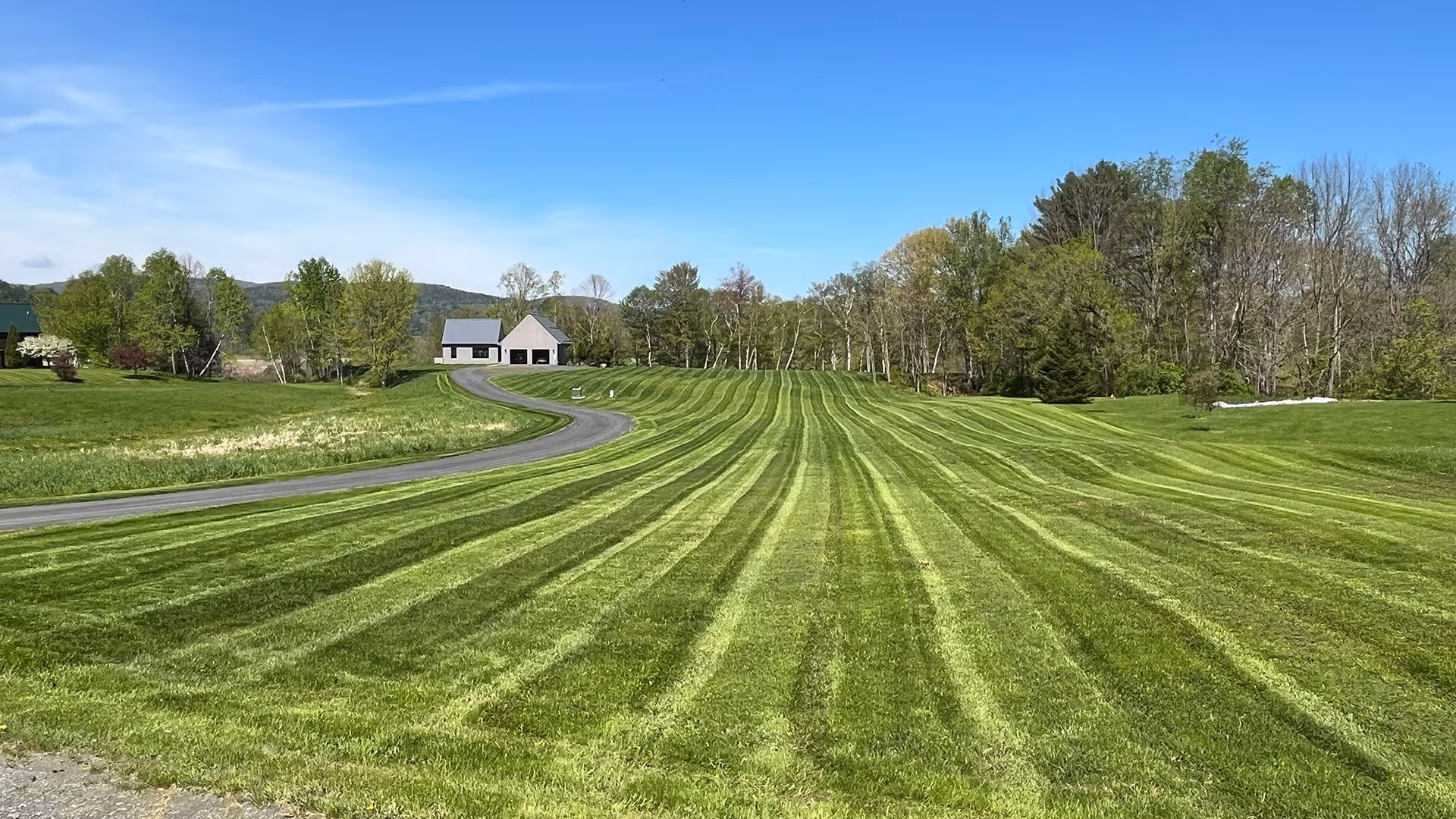 Professional lawn care mowing and maintenance for high end residential property near me by Gray's Property Maintenance