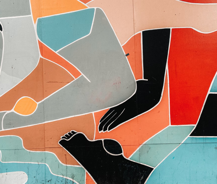 Abstract mural with stylized black hands and feet outlined in white against a background of peach, orange, teal, and gray geometric shapes.