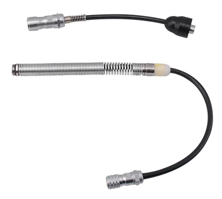 Two black cables with metallic connectors and flexible protective metal coils.