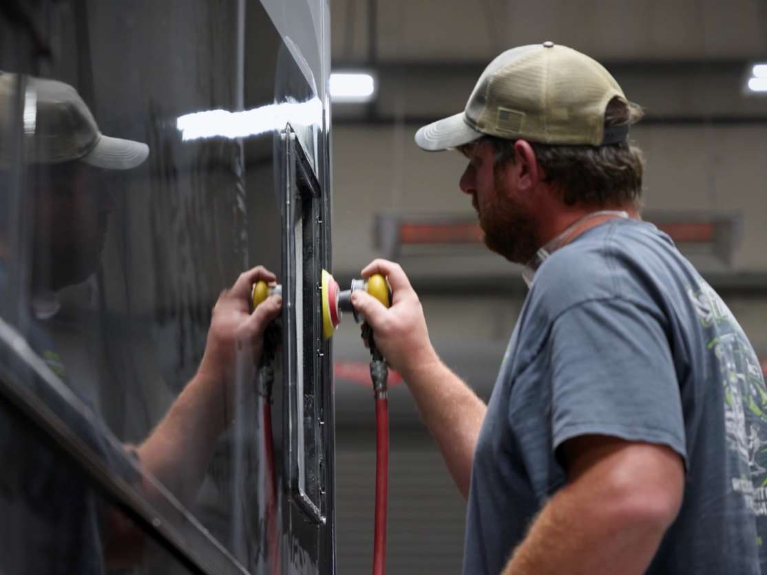 Cornerstone tech installing the fiberglass of a Tru-frame exterior wall