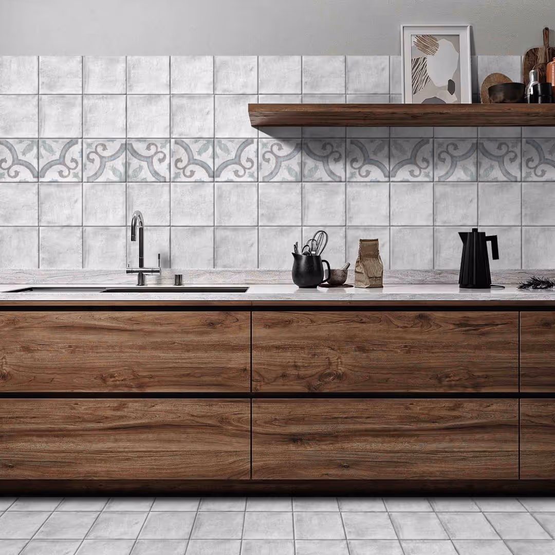 Modern kitchen with wood grain lower cabinets, patterned grey tile backsplash, and wooden shelf with kitchen decor in contemporary kitchen design.