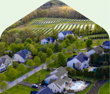 Community Solar for Local Neighborhoods Aerial view of a neighborhood near a community solar installation.