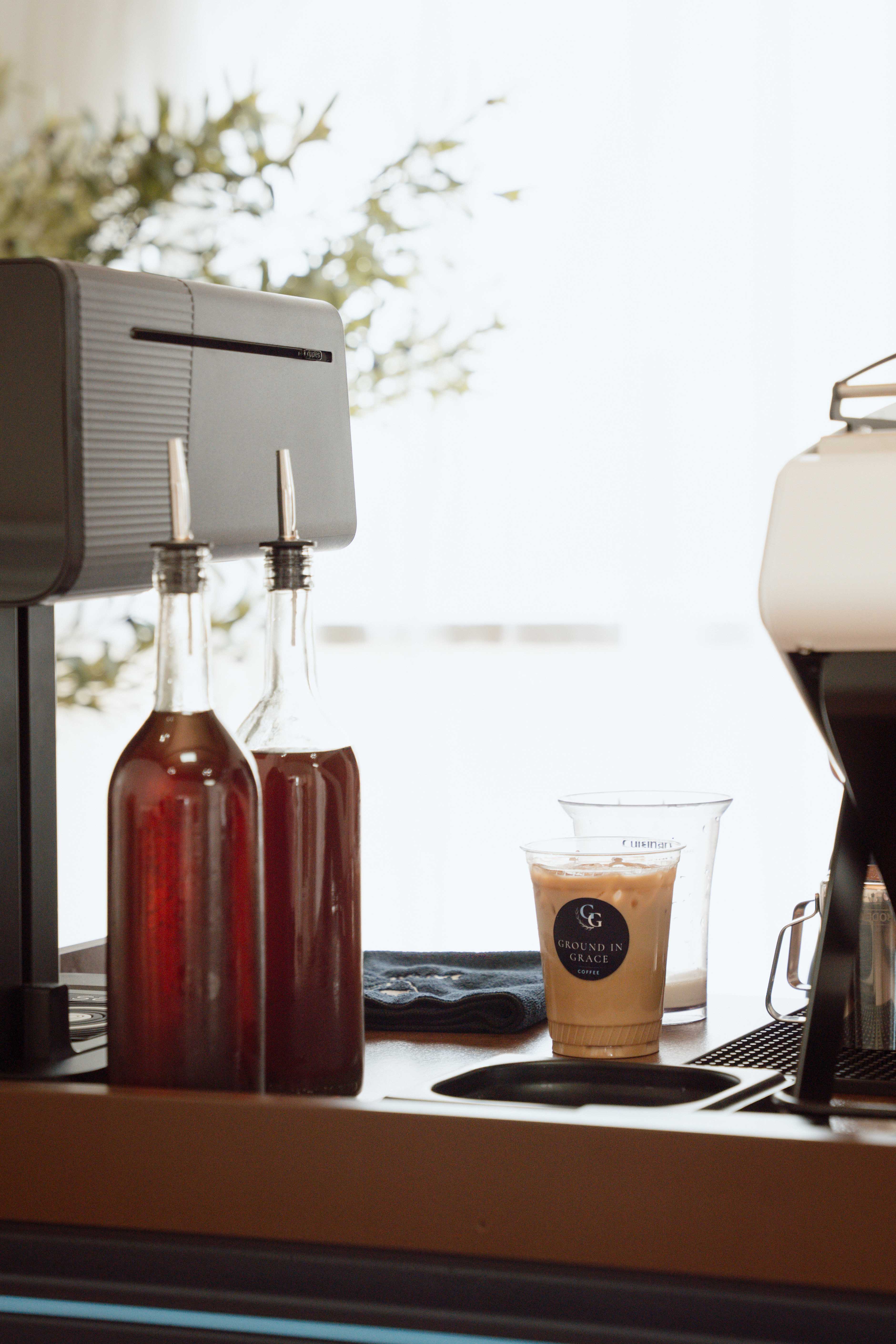image of housemate syrups on espresso bar cart