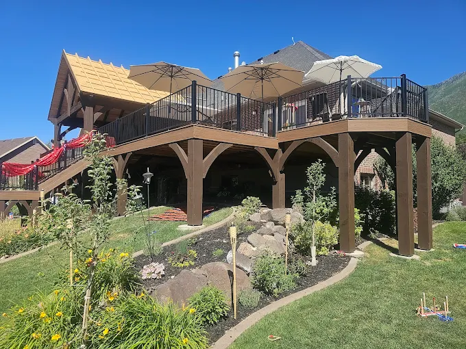 Elevated deck on timber posts above a landscaped rock garden slope