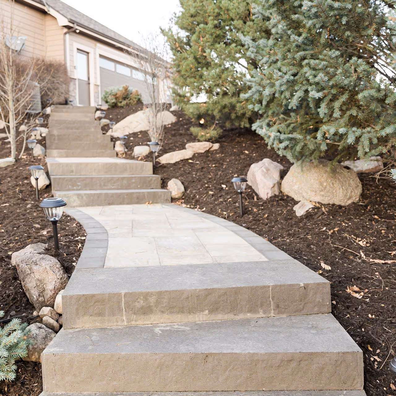 Front Range Outdoor Solutions custom paver patio installation in Windsor CO
