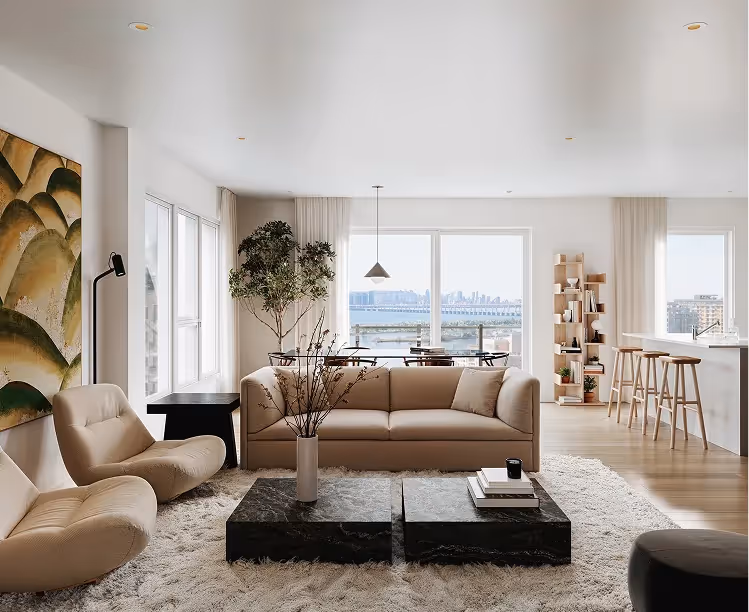 Living room with beige sofa, black marble coffee table and river view