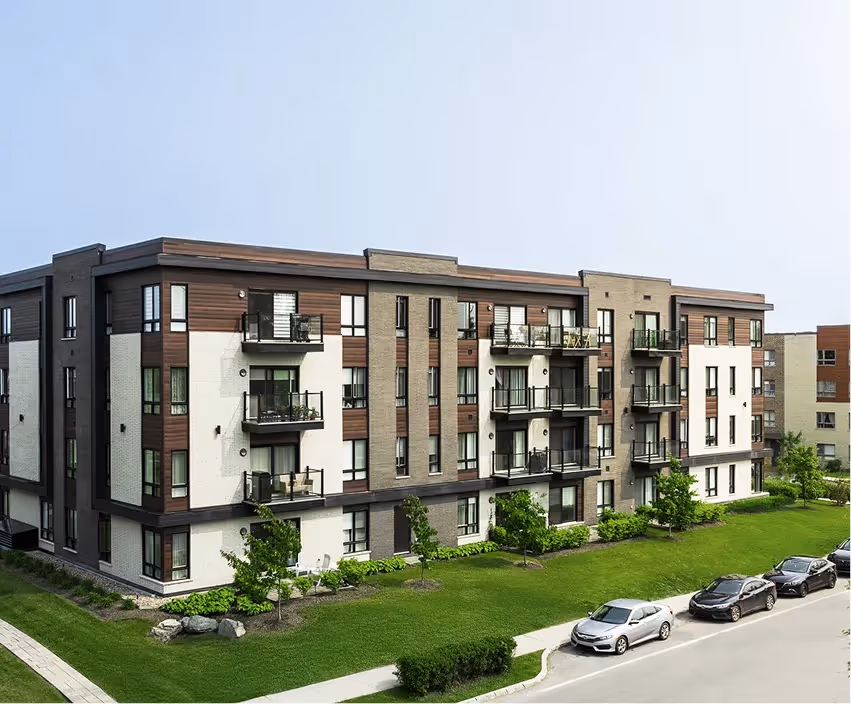 Modern residential building with wooden balconies and landscaping