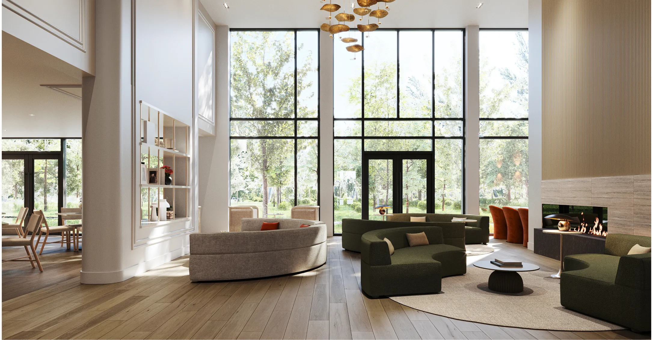 Espace commun du Nest Immobilier avec canapés arrondis, cheminée et grandes baies vitrées sur la verdure