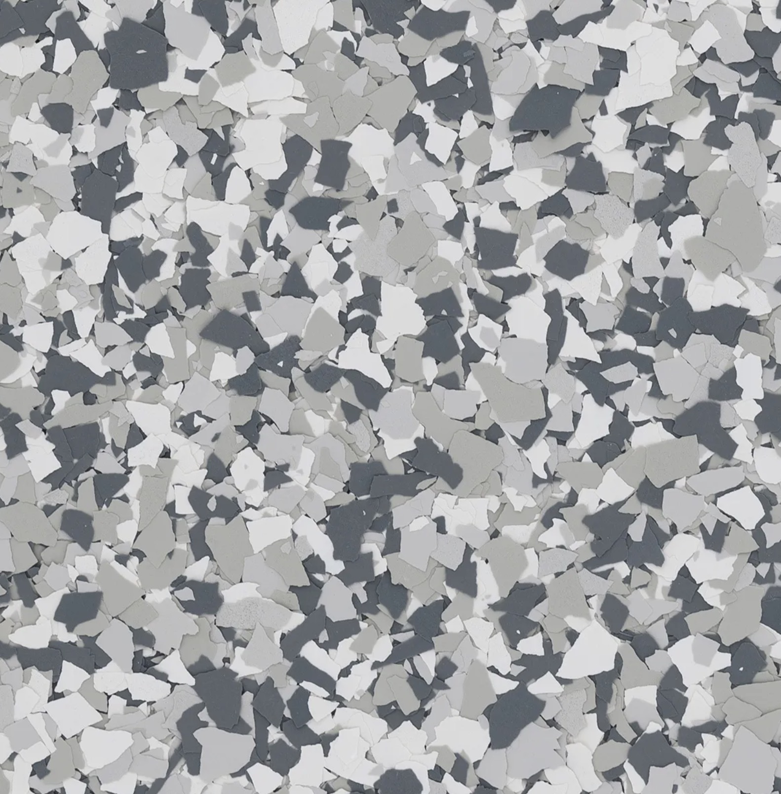 Workshop with tools on pegboard, workbench, metal tool chest, and air compressors on concrete floor.