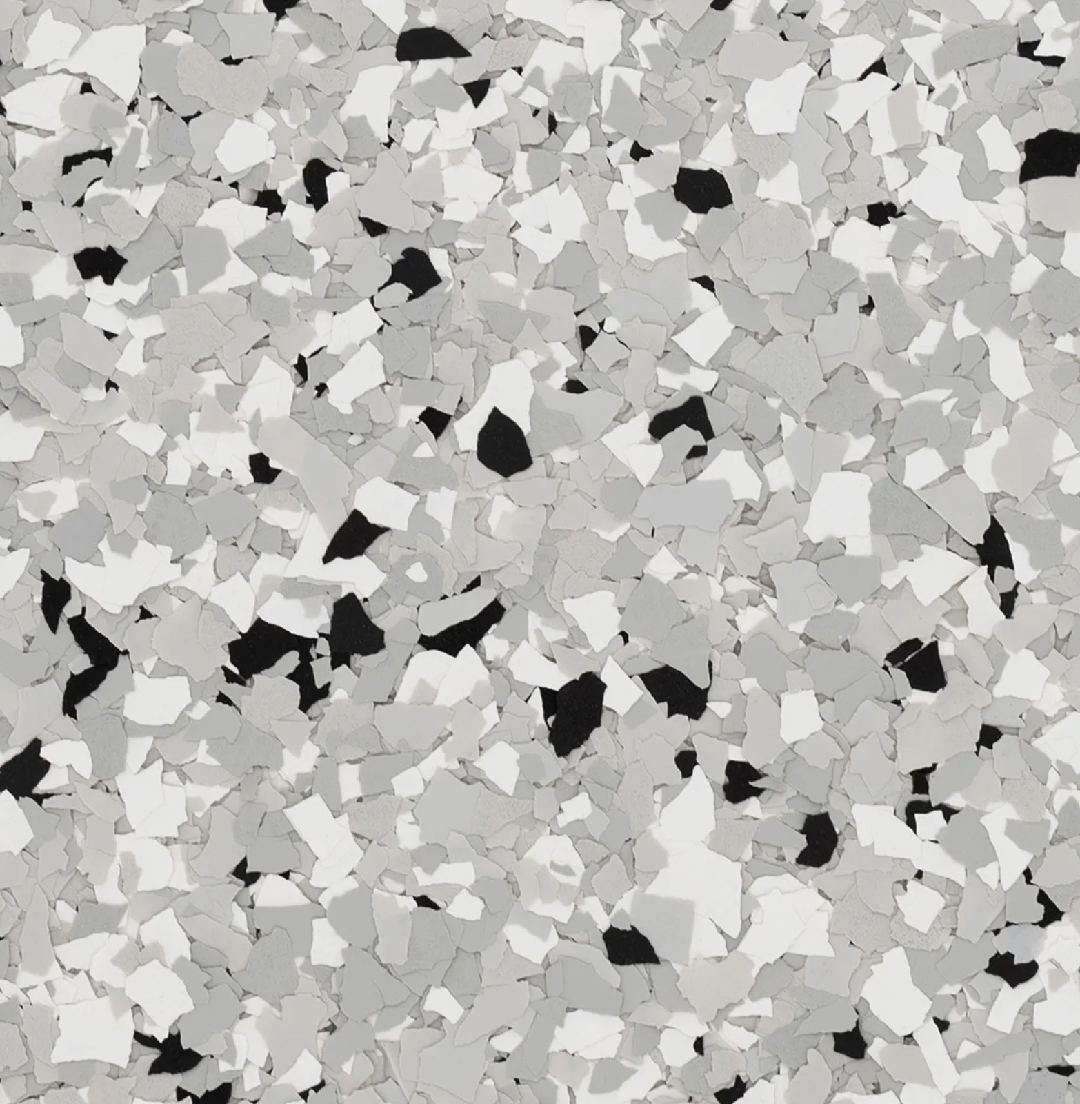 Workshop with tools on pegboard, workbench, metal tool chest, and air compressors on concrete floor.